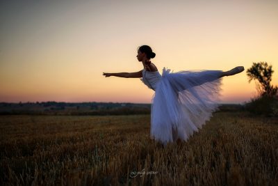 white dressed ballerina in the sunset
